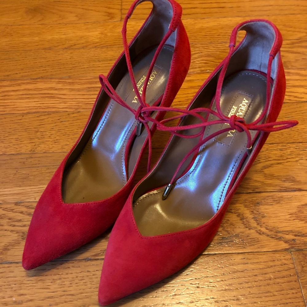 Aquazzura red heel with tie design.